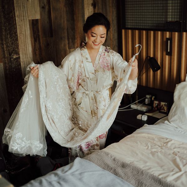 bride holding her wedding dress
