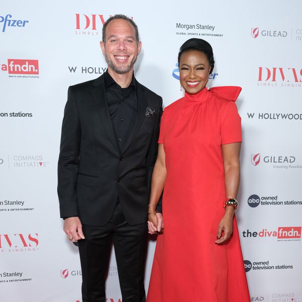 Vaughn Rasberry and Tatyana Ali holding hands and beaming at theater