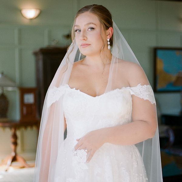 bride wearing off-the-shoulder wedding dress