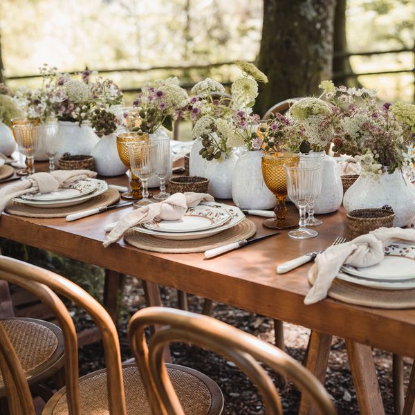 Rustic Wedding Tablescape With White Vases and Natural Flowers