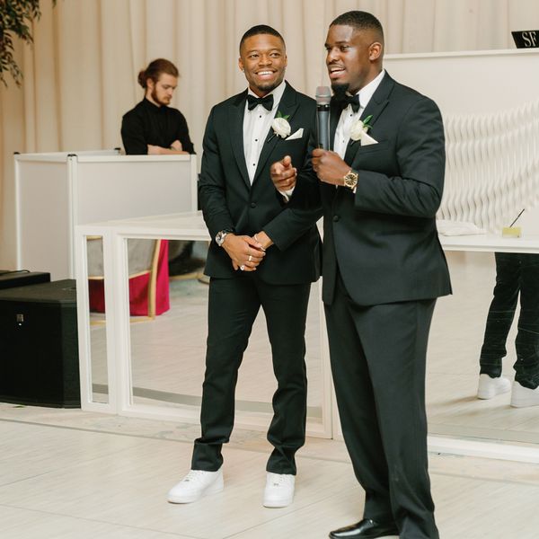 two men giving wedding speeches