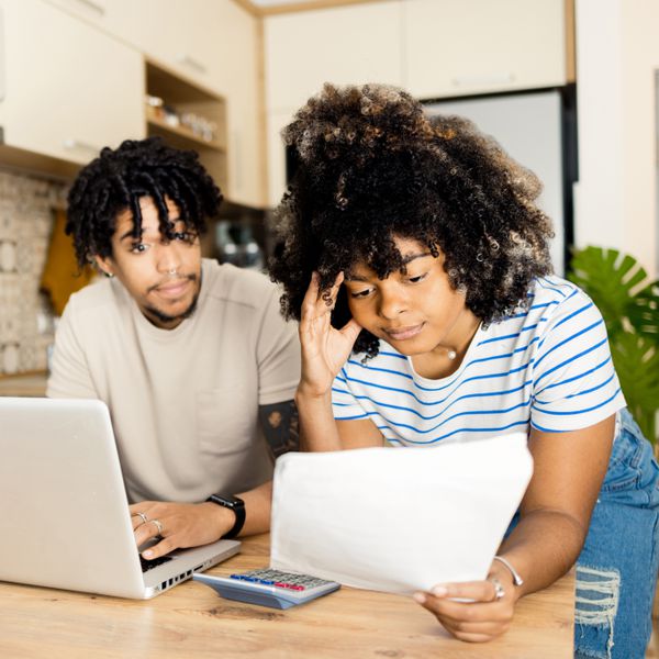 Stressed young couple is managing their household tasks