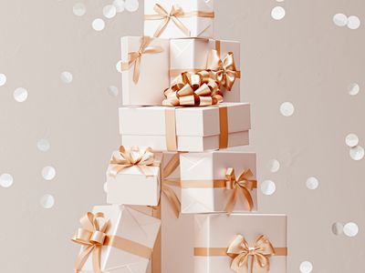 Stack of White Gifts Tied with Pink Ribbon