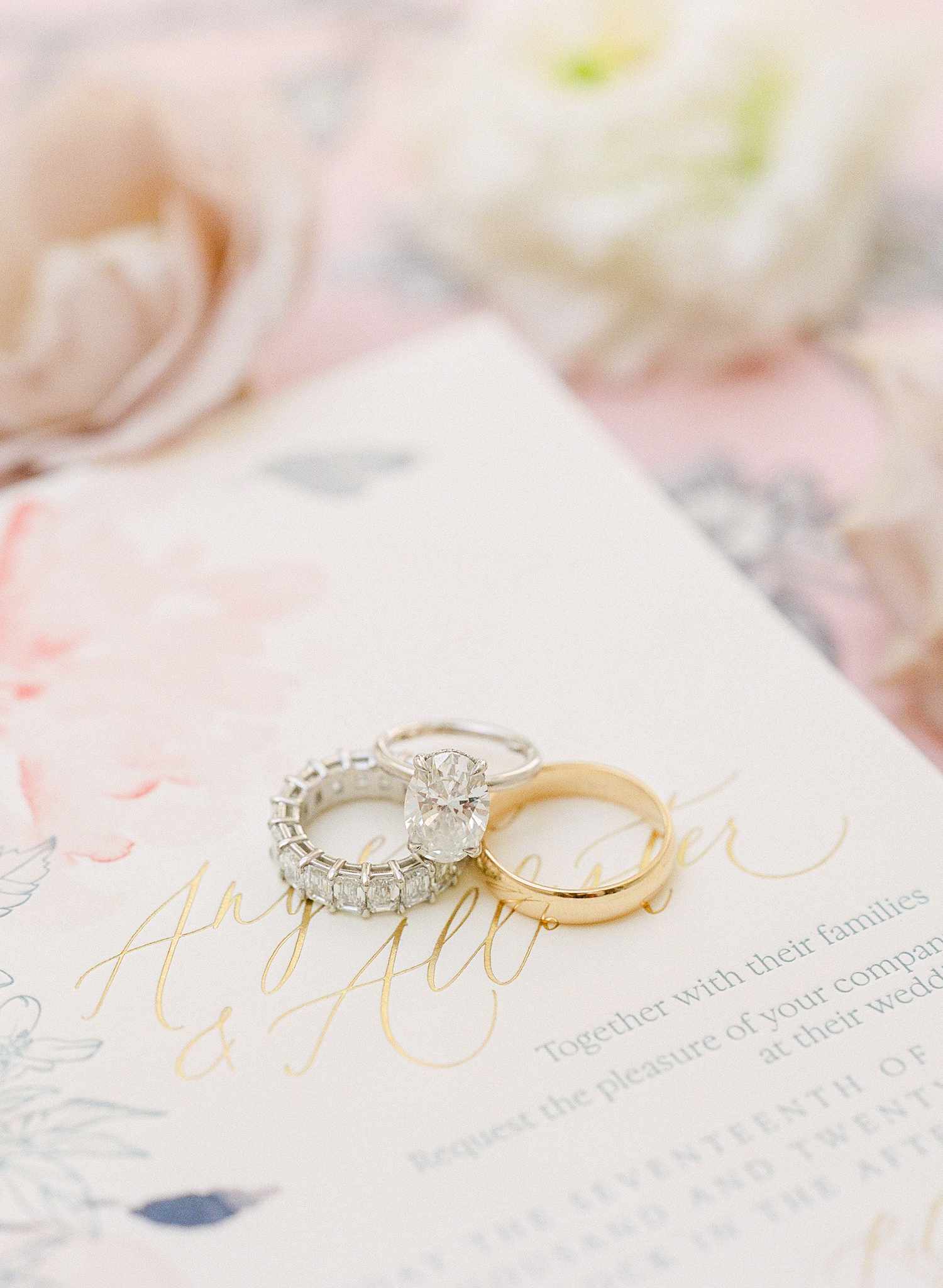 engagement ring and two wedding bands