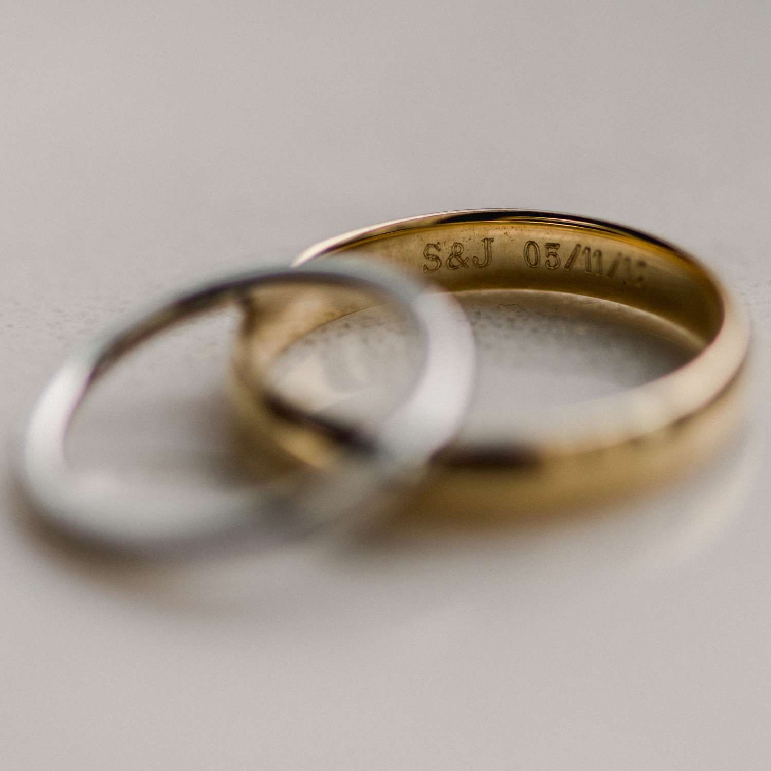 silver and gold wedding bands with custom engraving