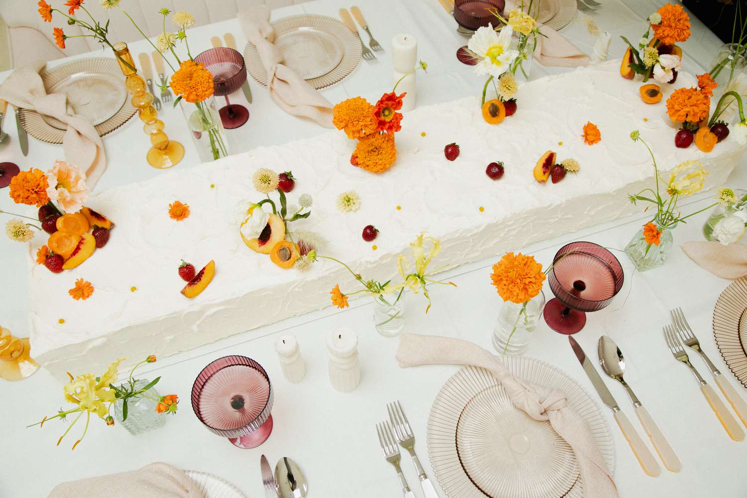 Extra-Long Wedding Sheet Cake Centerpiece With Stone Fruit and Berries Displayed on Tablescape