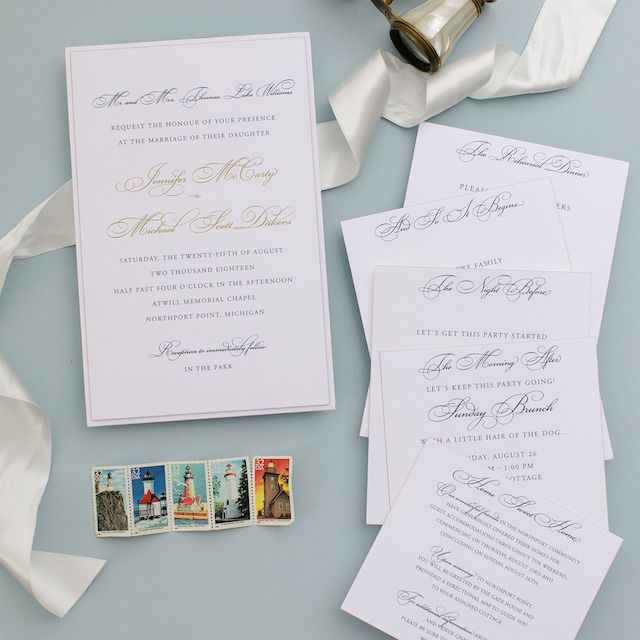 Invitation suite on blue background with lighthouse stamps