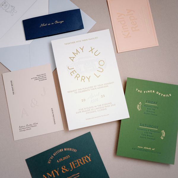 Multi-Colored Wedding Invitation Suite With Green, Pink, and Cream Cards and Blue Envelopes
