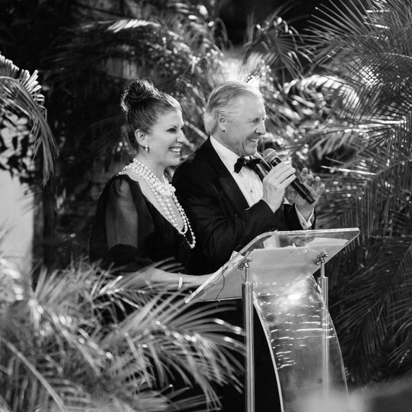 A Bride's Parents Give a Wedding Toast With a Microphone