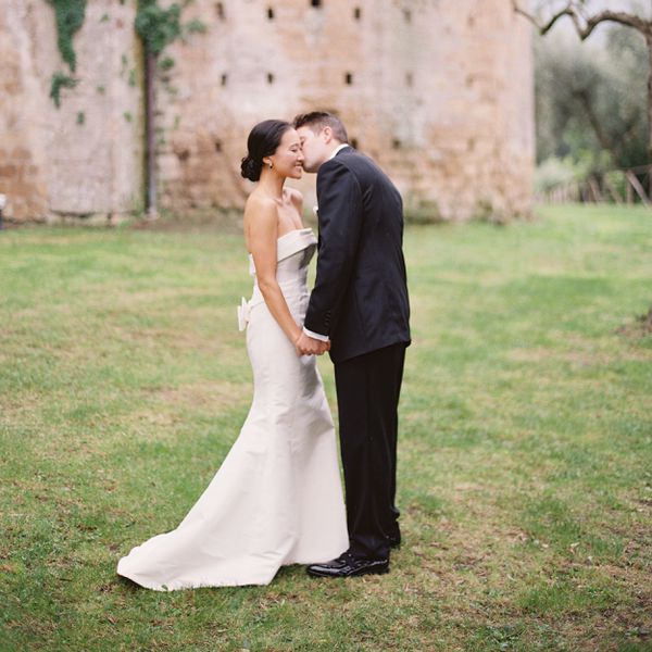 husband kissing wife in italy