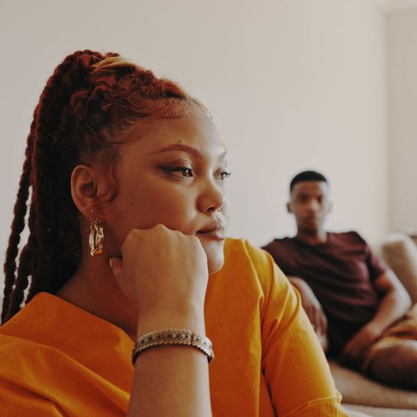 Woman Contemplates "Should I Break Up With My Boyfriend?" While Thinking About Their Relationship