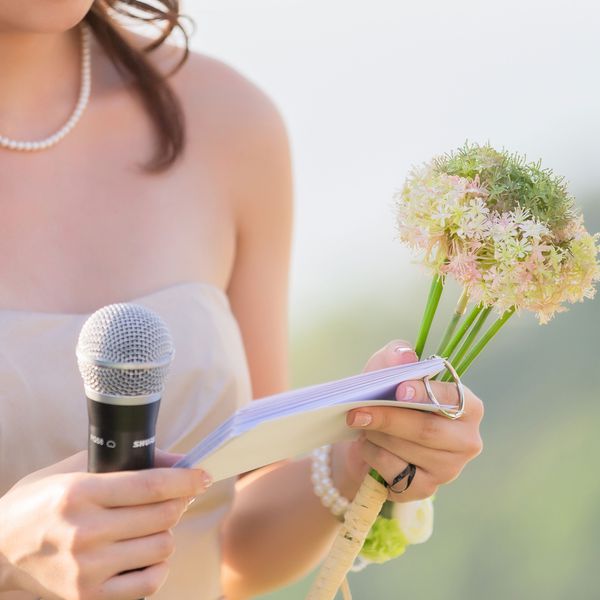 Woman Gives a Speech at Wedding With Microphone