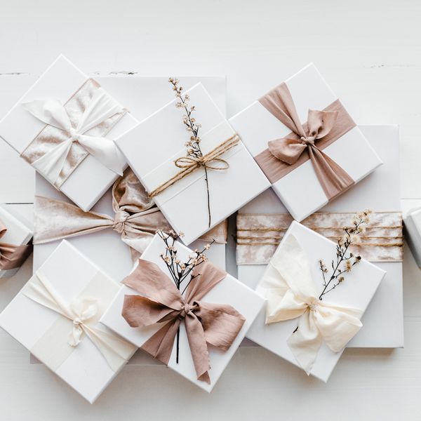 White Gift Boxes Wrapped with Pink and White Ribbons