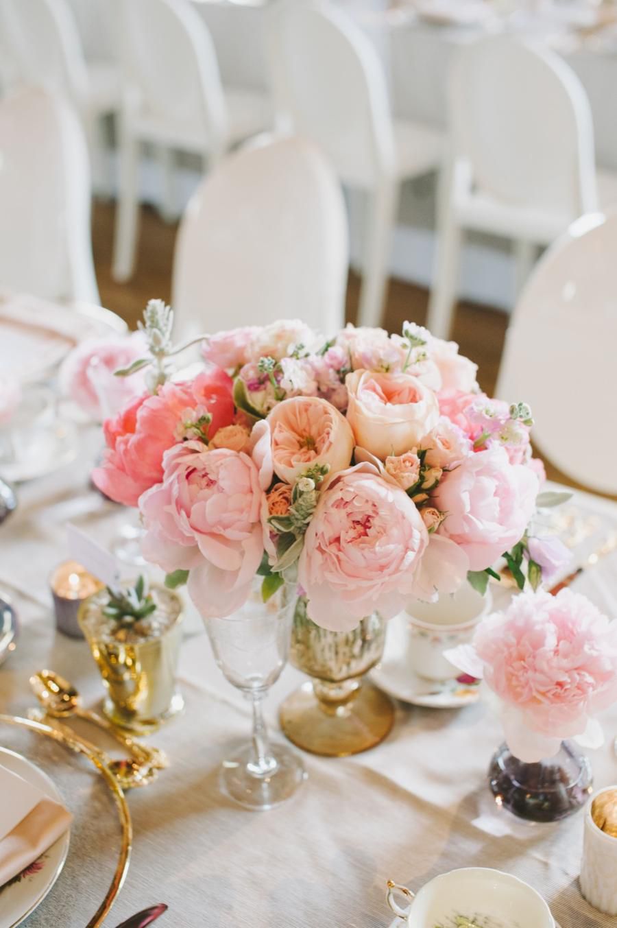 pink peony centerpiece on all white tablescape with gold details
