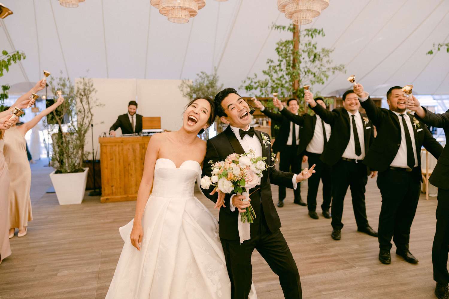 newlyweds and their wedding party perform a choreographed reception entrance to a song from Hairspray