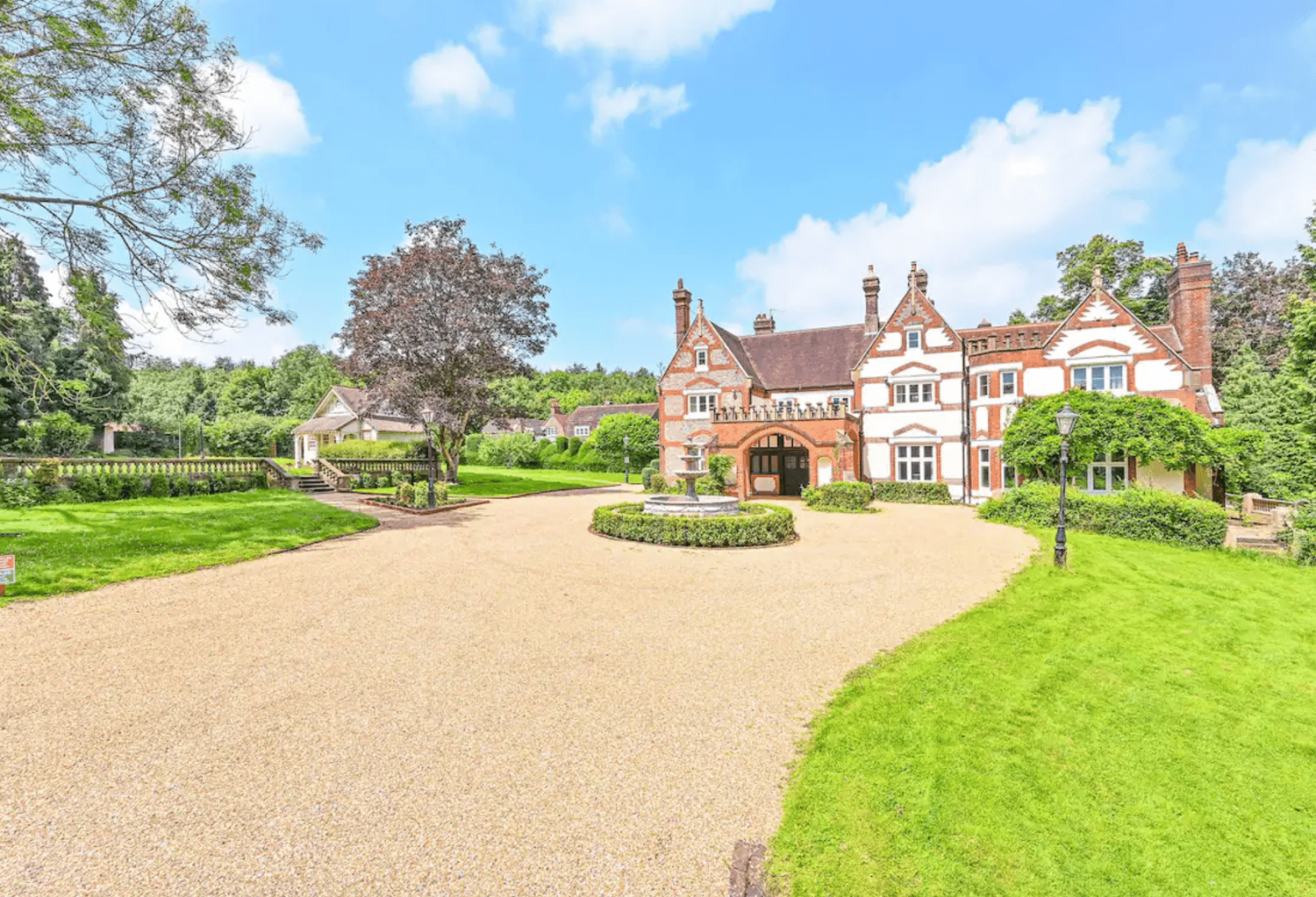 Long Driveway Leading to Brick Manor in English Countryside