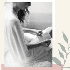 Black and white photo of a woman writing her vows on a card over an illustration.